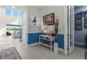 Bright foyer with tile flooring and stylish decor, creating a welcoming entrance to the home at 14639 Winter Stay Dr, Winter Garden, FL 34787