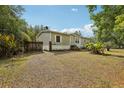 View of the side of the house with wooden fence at 2229 N 6Th St, Orlando, FL 32820