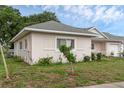 Well-maintained side exterior view of the home showing windows and landscaping at 3162 Little Sound Dr, Orlando, FL 32827