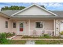Inviting front porch with chairs, plants, and a pathway leading to the home's entrance at 3162 Little Sound Dr, Orlando, FL 32827