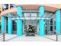 Elegant condo building entrance features modern architecture and glass doors at 322 E Central Blvd # 1612, Orlando, FL 32801