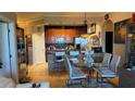 Open floor plan showcasing the kitchen with stainless steel appliances and a dining area at 3338 Robert Trent Jones Dr # 30704, Orlando, FL 32835
