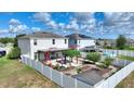 Aerial view of fenced-in backyard with pergola, gazebo, and pool at 372 Willet St, Haines City, FL 33844