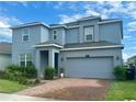 Lovely home with a brick driveway, tidy landscaping and a two-car garage at 5054 Tibet Ct, St Cloud, FL 34772