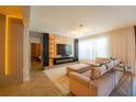 Relaxing living room with modern design and a comfortable sofa with a decorative entertainment center at 8137 Pond Apple Dr, Winter Garden, FL 34787