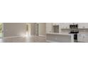 Modern kitchen featuring white cabinets, stainless steel appliances and a large island at 12460 Sw 48 Lane Rd, Ocala, FL 34481