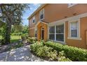Charming home exterior with lush green landscaping and a welcoming walkway at 2330 Little Gem Loop, Sanford, FL 32773