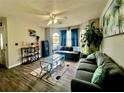 Bright living area with tile flooring, a ceiling fan, and comfortable seating for relaxing and entertaining at 2376 Flamingo Lakes Dr, Kissimmee, FL 34743