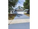 Charming single-Gathering home with a two-car garage and well-maintained landscaping at 3446 Cypress Point Cir, St Cloud, FL 34772