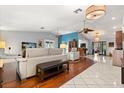 Open-concept living room showcasing unique flooring design, modern seating, and neutral wall color at 1247 Rosemary Dr, Orlando, FL 32807