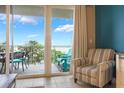Inviting balcony with chairs and table, offering scenic views and a perfect spot for relaxation at 13427 Blue Heron Beach Dr # 306, Orlando, FL 32821