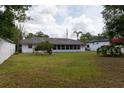 Expansive backyard with mature landscaping and ample green space surrounding the home at 1418 Oregon St, Orlando, FL 32803