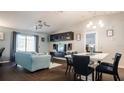 Open-concept living and dining area with hardwood floors and contemporary decor at 16116 Corner Lake Dr, Orlando, FL 32820