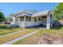 Cozy home displaying a convenient covered carport and driveway at 1615 Crestwood Dr, Orlando, FL 32804