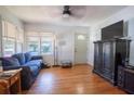 Bright living room features hardwood floors, and ample natural light at 1615 Crestwood Dr, Orlando, FL 32804