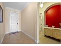 Inviting entryway featuring tile flooring and a glimpse into adjacent rooms at 23820 Sardinia Dr, Sorrento, FL 32776