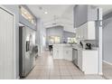 Well-lit kitchen with modern stainless steel appliances and updated countertops at 2511 Brookstone Dr, Kissimmee, FL 34744