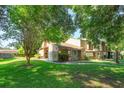 Brick home with a lush lawn and mature trees offers a serene and inviting setting at 470 Oak Haven Dr # 470, Altamonte Springs, FL 32701