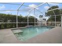 Relaxing screened-in pool area with plenty of space for lounging and a shed at 4927 Fiske Cir, Orlando, FL 32826