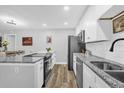 Modern kitchen with stainless steel appliances and granite countertops at 508 Boxelder Ave, Altamonte Springs, FL 32714