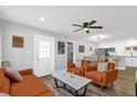 Open-concept living room with contemporary decor and seamless flow to the kitchen at 508 Boxelder Ave, Altamonte Springs, FL 32714