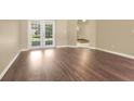 Bright living area with new floors and French doors leading to the backyard at 922 Hatteras Ave, Minneola, FL 34715