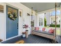 Cozy porch with a swing, plants, and a welcoming entrance at 1071 Kershaw Dr, Winter Garden, FL 34787