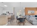 Spacious living area with stylish seating, dining area, and a functional breakfast bar at 1084 Park Ridge Cir, Kissimmee, FL 34746