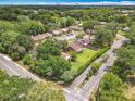 Community aerial view with tree coverage and neatly manicured lawns at 1591 Revere Ln, Daytona Beach, FL 32117