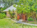 A charming home with brick and siding, complemented by lush landscaping and a welcoming entrance at 1591 Revere Ln, Daytona Beach, FL 32117