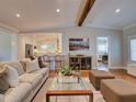 Inviting living room featuring hardwood floors, neutral colors, and an open layout with a kitchen at 1791 Spruce Ave, Winter Park, FL 32789