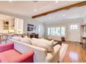 Cozy living room boasts hardwood floors, natural light, and an open layout with an eat-in kitchen at 1791 Spruce Ave, Winter Park, FL 32789