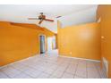 Bright living room with tile floors, high ceilings, and neutral paint ready for customization at 2041 Swanson Dr, Deltona, FL 32738