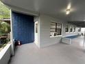 Exterior view with painted blue brick, neutral grey siding and convenient covered carport at 2829 Sanford Ave, Sanford, FL 32773