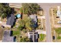 An aerial view showcasing a home with a pool and proximity to neighborhood streets at 3403 Canute Pl, Orlando, FL 32818