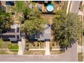 Aerial view of a home with a backyard swimming pool and mature trees at 3403 Canute Pl, Orlando, FL 32818