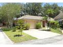 Inviting single-Gathering home featuring a well-manicured front yard, attached garage, and classic residential charm at 4035 Palo Alto Ct, Orlando, FL 32817