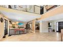 Spacious living room features a soaring ceiling, neutral paint, and beautiful tile flooring at 4674 Hall Rd, Orlando, FL 32817
