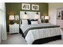 Well-appointed bedroom with a padded headboard, accent lighting, and neutral tones, creating a relaxing space at 499 Silver Palm Dr, Haines City, FL 33844