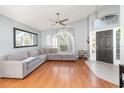 Bright living room boasts hardwood floors and a large window for natural light and ample space at 637 Blenheim Loop, Winter Springs, FL 32708