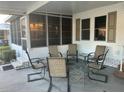Relaxing covered patio with comfortable seating and a view of the surroundings at 816 Polo Park East Blvd, Davenport, FL 33897
