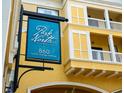 Park North at Cheney Place sign at 860 North Orange Avenue displayed on the side of a yellow condo building at 860 N Orange Ave # 323, Orlando, FL 32801
