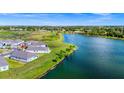 Beautiful aerial shot of lakeside homes, showcasing the community's scenic waterfront location at 1590 Contentment Loop, Kissimmee, FL 34744