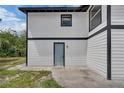 Side exterior view of a home with black and white trim at 1840 Lillian Dr, St Cloud, FL 34771