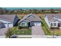 An aerial view showcases this single Gathering home's beautiful landscaping at 18851 Rawson St, Orlando, FL 32827