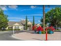 Exterior of community clubhouse with manicured landscaping and ample parking at 2208 San Vittorino Cir # 104, Kissimmee, FL 34741