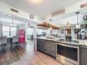 Spacious kitchen with a large island, stainless steel appliances, and views into the living area at 3788 N Econlockhatchee Trl, Orlando, FL 32817