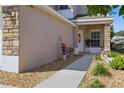 Charming front entrance with decorative stone accents and a well-maintained walkway and inviting curb appeal at 5107 Ne 122Nd Blvd, Oxford, FL 34484