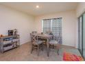 Cozy dining area with a modern table set, neutral colors, and a sliding glass door at 5367 Douglas Fir Dr, St Cloud, FL 34771
