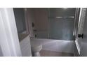 Bathroom with tile floor and a tub/shower with sliding glass door at 5418 Brookswood Way # 100 Brookwood Way # 1008, Orlando, FL 32808